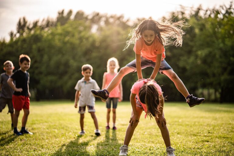 kids playing leap frog - vintage or retro party theme